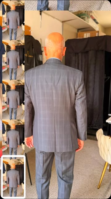 Back view of a grey plaid custom suit during a fitting